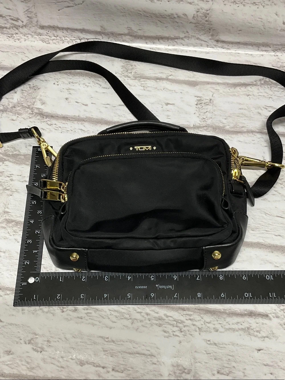 Tumi Black Nylon Crossbody with Gold Hardware Accents